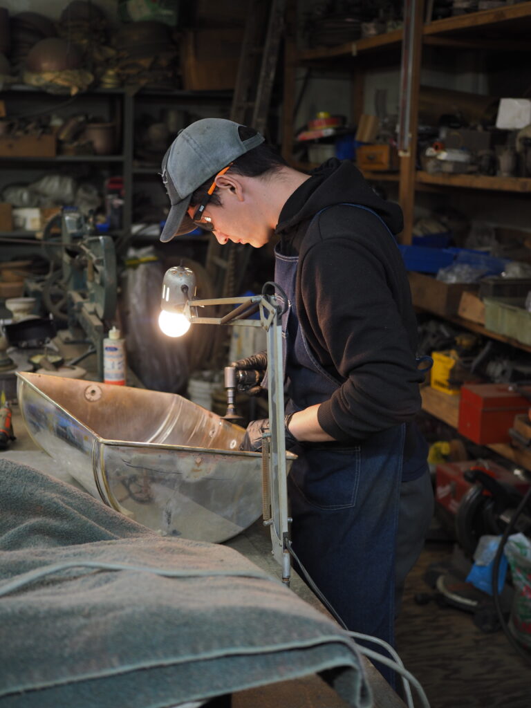 Alecsander Poliscuk working in the shop.